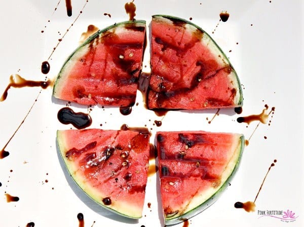 Image of a grilled watermelon with balsamic vinegar drizzled over it