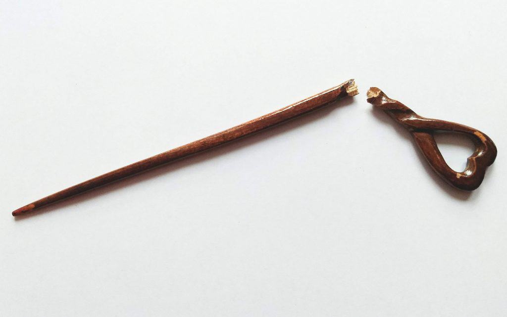 Image of a thin, broken hair stick